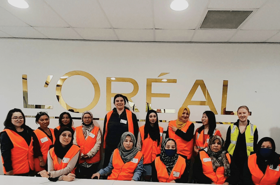 Sisters taking a workplace tour at L’Oréal.