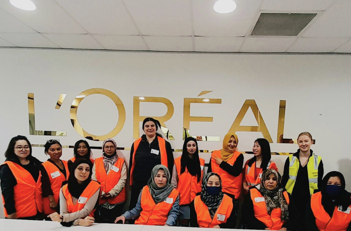 Sisters taking a workplace tour at L’Oréal.